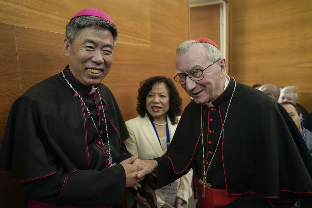 Shanghai Bishop Joseph Shen Bin (left) shakes hands with Vatican Foreign Minister Cardinal Pietro Parolin in an international conference organized by the Pontifical Urban University, in Rome, Italy, on May 21, 2024.