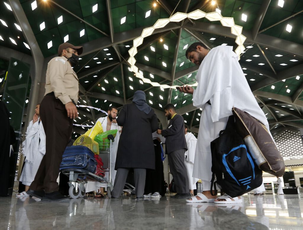 Pilgrims on their way to Mecca enter the Haramain High-Speed Railway station in the holy city of Medina Saudi Arabia, Thursday, Aug. 8, 2019. Hundreds of thousands of Muslims have arrived in the kingdom to participate in the annual hajj pilgrimage, which starts Friday, a ritual required of all able-bodied Muslims at least once in their life. 