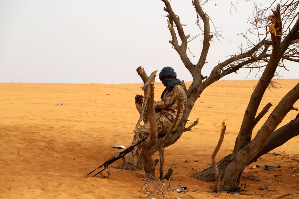 A militant from the Movement for the Salvation of Azawad (MSA), a Tuareg political and armed movement in the Azawad Region in Mali, rests in the desert outside Menaka on March 14, 2020 while on patrol. 
