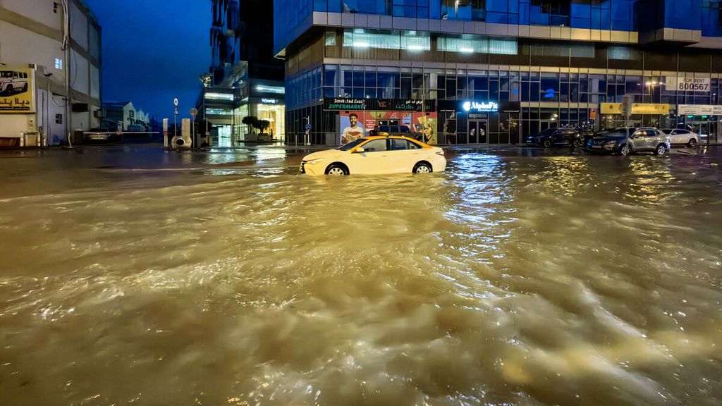 A taxi drives through floods in the middle of Dubai, United Arab Emirates, on April 17, 2024. Dubai, the financial center of the Middle East, was hit by heavy rain that triggered a massive flood.