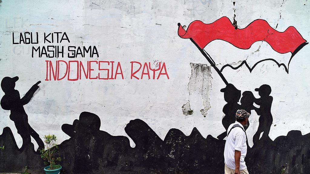 Polarisasi yang terjadi di masyarakat akibat pilkada menggerakkan sekelompok warga untuk mengampanyekan persatuan melalui mural terlihat di kawasan Cipayung, Tangerang Selatan, Banten, Sabtu (20/1).  