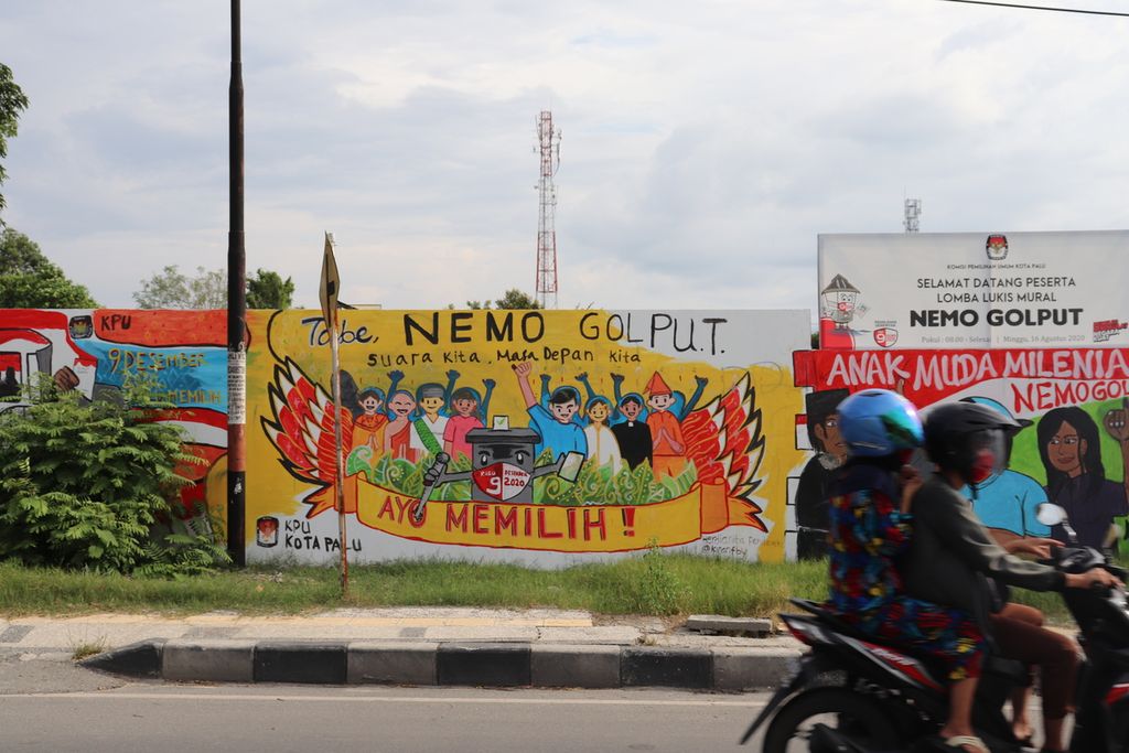 Lukisan dinding menampilkan ajakan untuk menggunakan hak pilih atau tidak golput (golongan putih) pada Pilkada 2020 di bilangan Kecamatan Palu Timur, Kota Palu, Sulawesi Tengah, Selasa (13/10/2020).