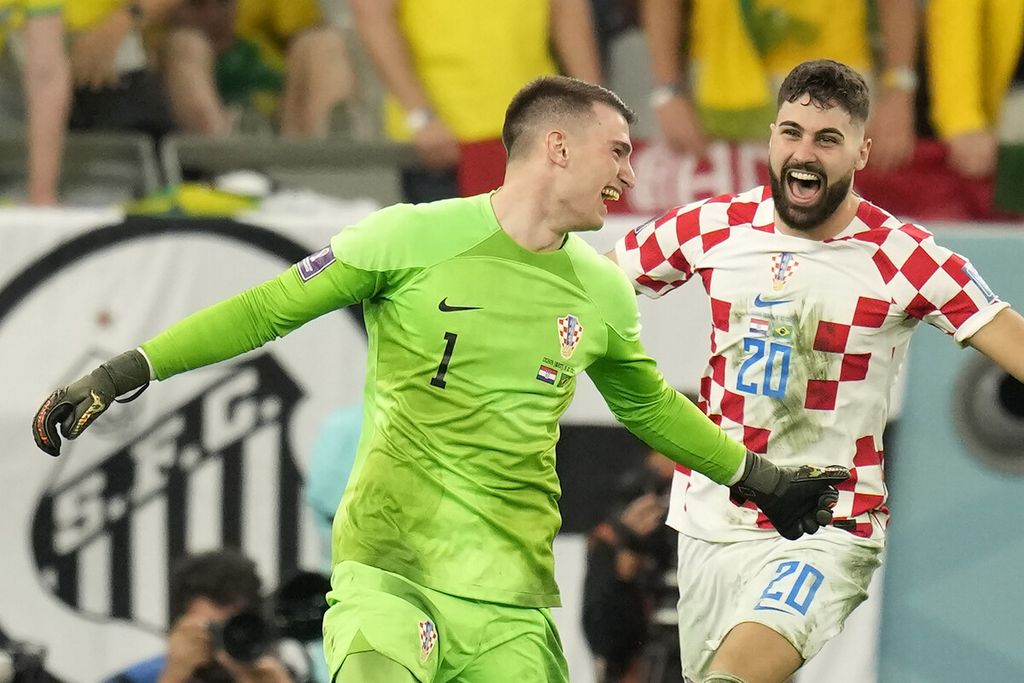 Croatia's goalkeeper Dominik Livakovic celebrates his team victory over Brazil after the penalty shootout in the World Cup quarterfinal soccer match between Croatia and Brazil, at the Education City Stadium in Al Rayyan, Qatar, Friday, Dec. 9, 2022. 