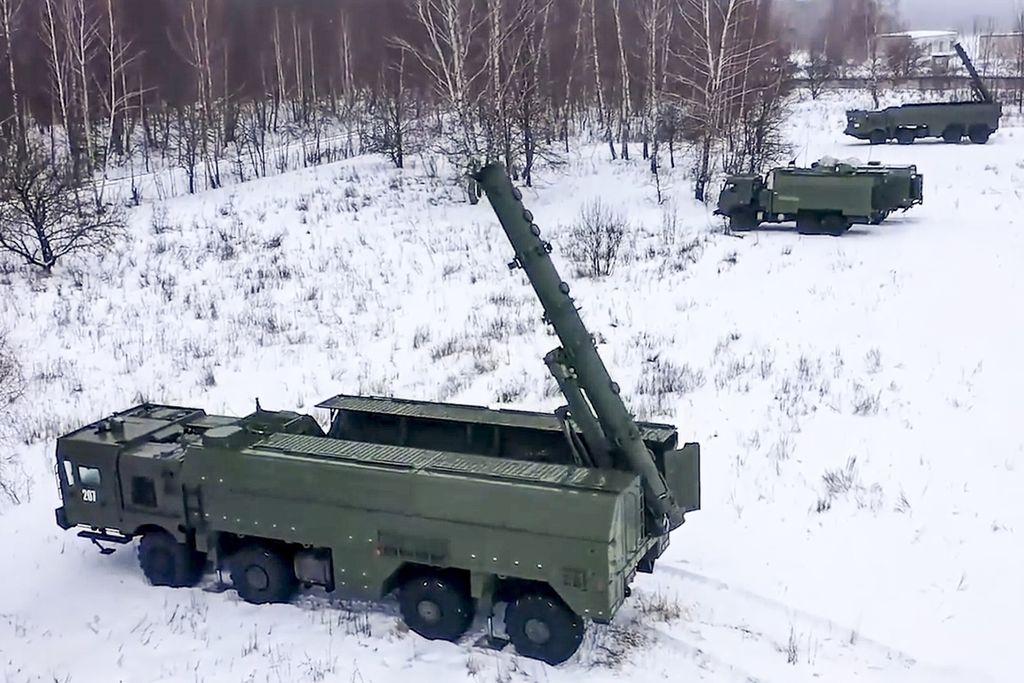 The photo released by the Press Office of the Russian Ministry of Defense shows Russian Army's Iskander missile launcher vehicles taking position during a military exercise.