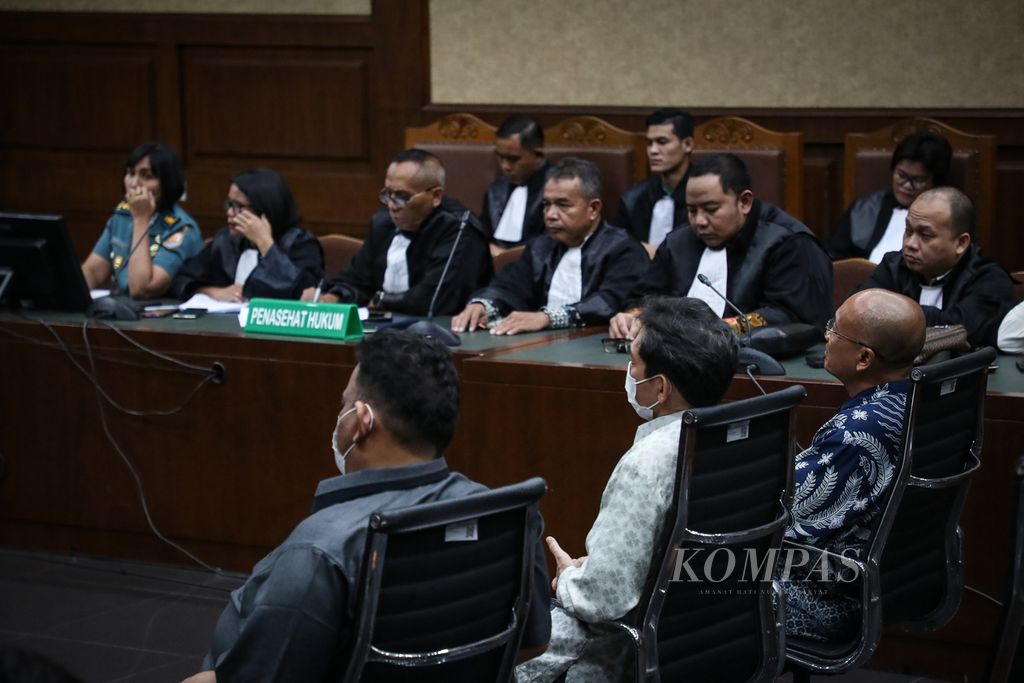 Defendants Surya Cipta Witoelar, Kusuma Arifin Wiguna, and Laksamana Muda (Ret.) Agus Purwoto (from left to right) attend a trial reading at the Jakarta Corruption Court on Monday, July 17, 2023.