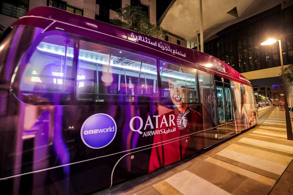 A tram drives past in the Qatari capital Doha on October 13, 2022, ahead of the Qatar 2022 FIFA World Cup. - The first world cup to take place in the Arab world, is scheduled to kick off on November 20, with the host nation Qatar taking on Ecuador. 